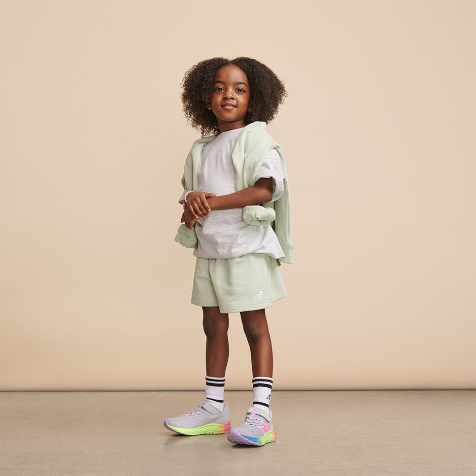 Kids Fresh Foam Arishi white with rainbow soles.