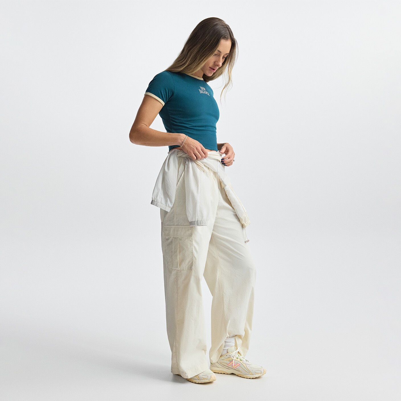 Woman wearing New Balance Unisex 204L Shoes and outfit