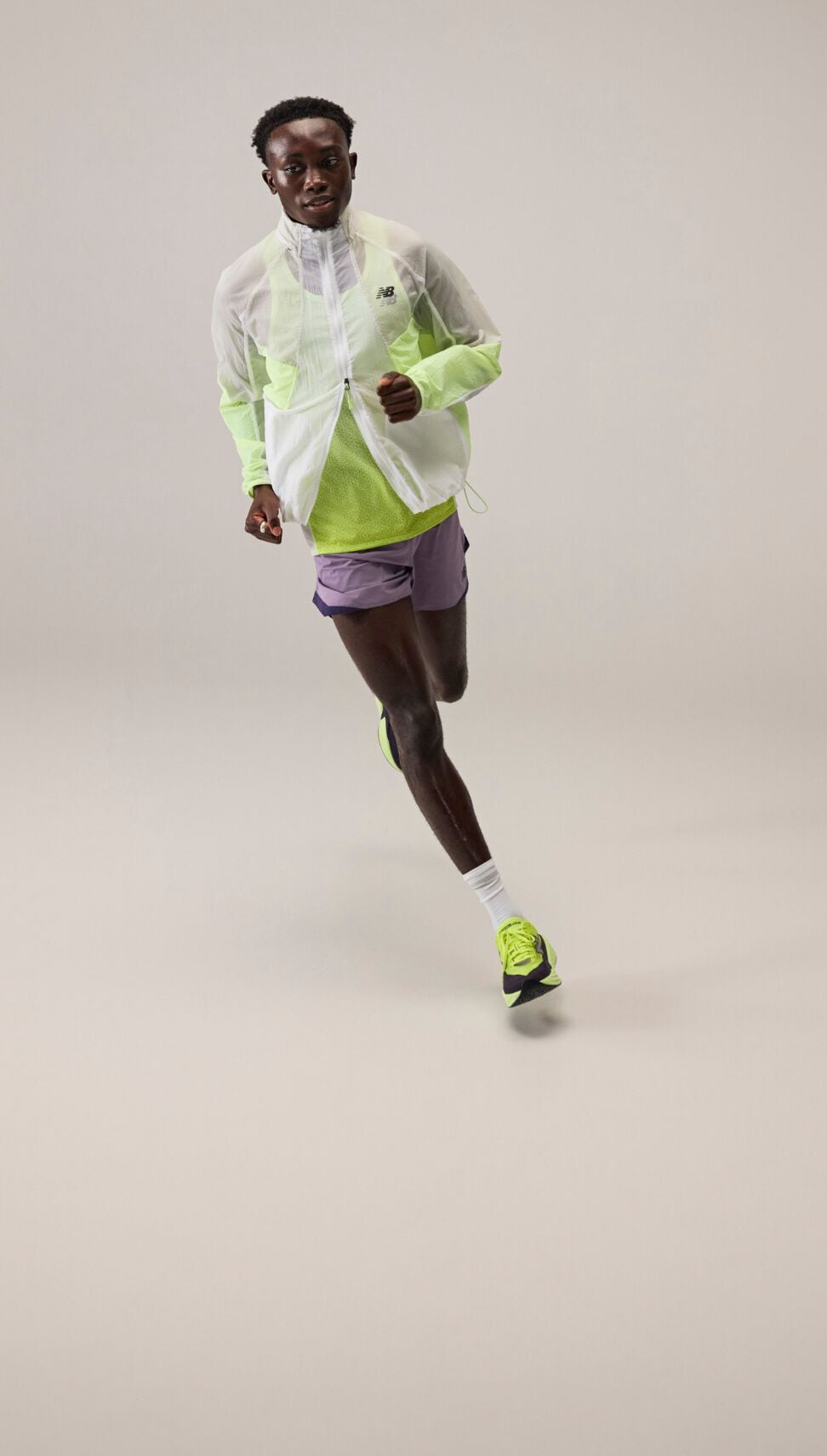 Man in running jacket and shorts.