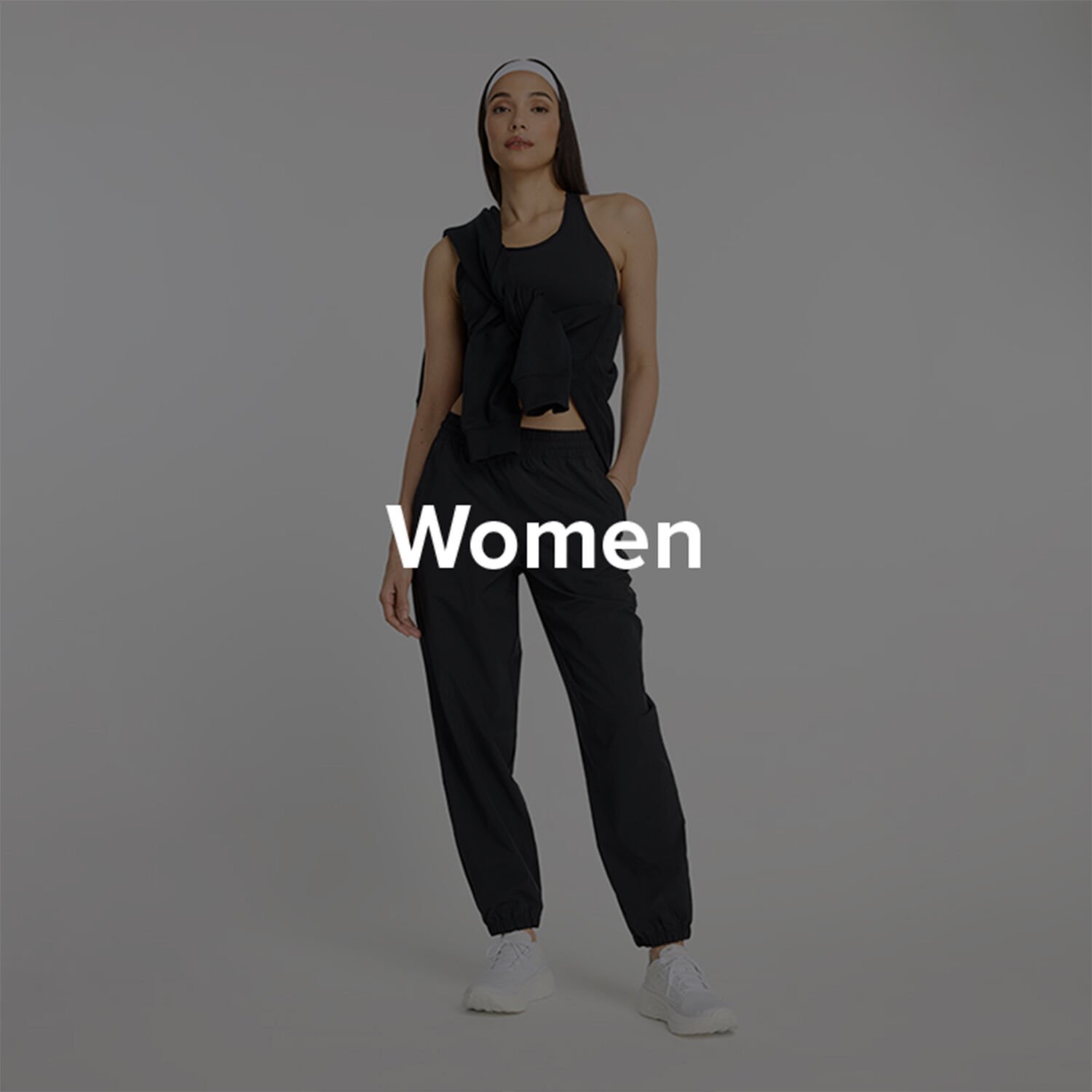 Woman in New Balance black clothes.