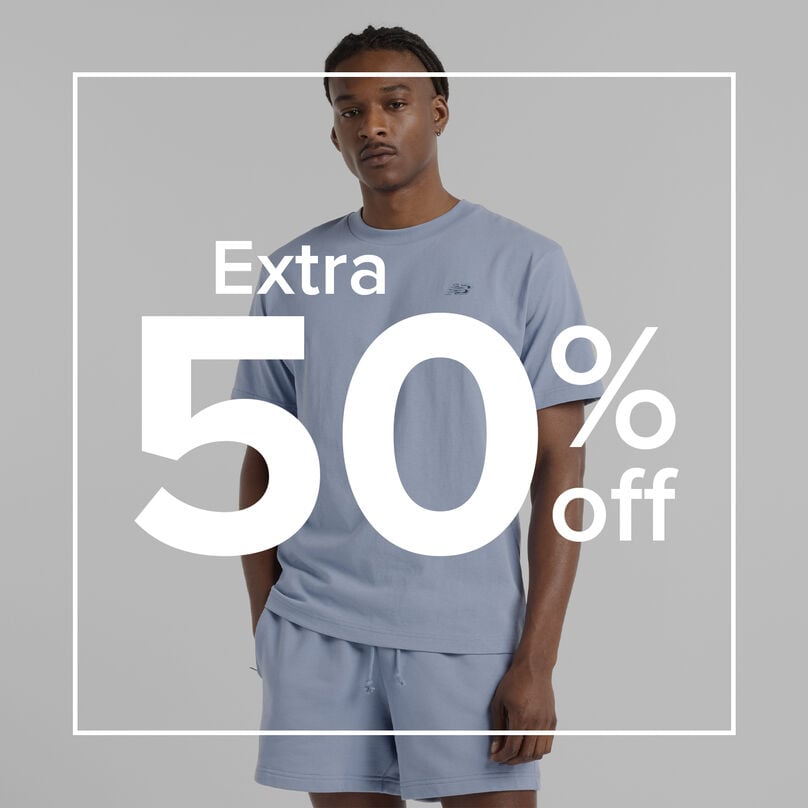 Man in New Balance outfit with overlay ' Extra 50% off ' 