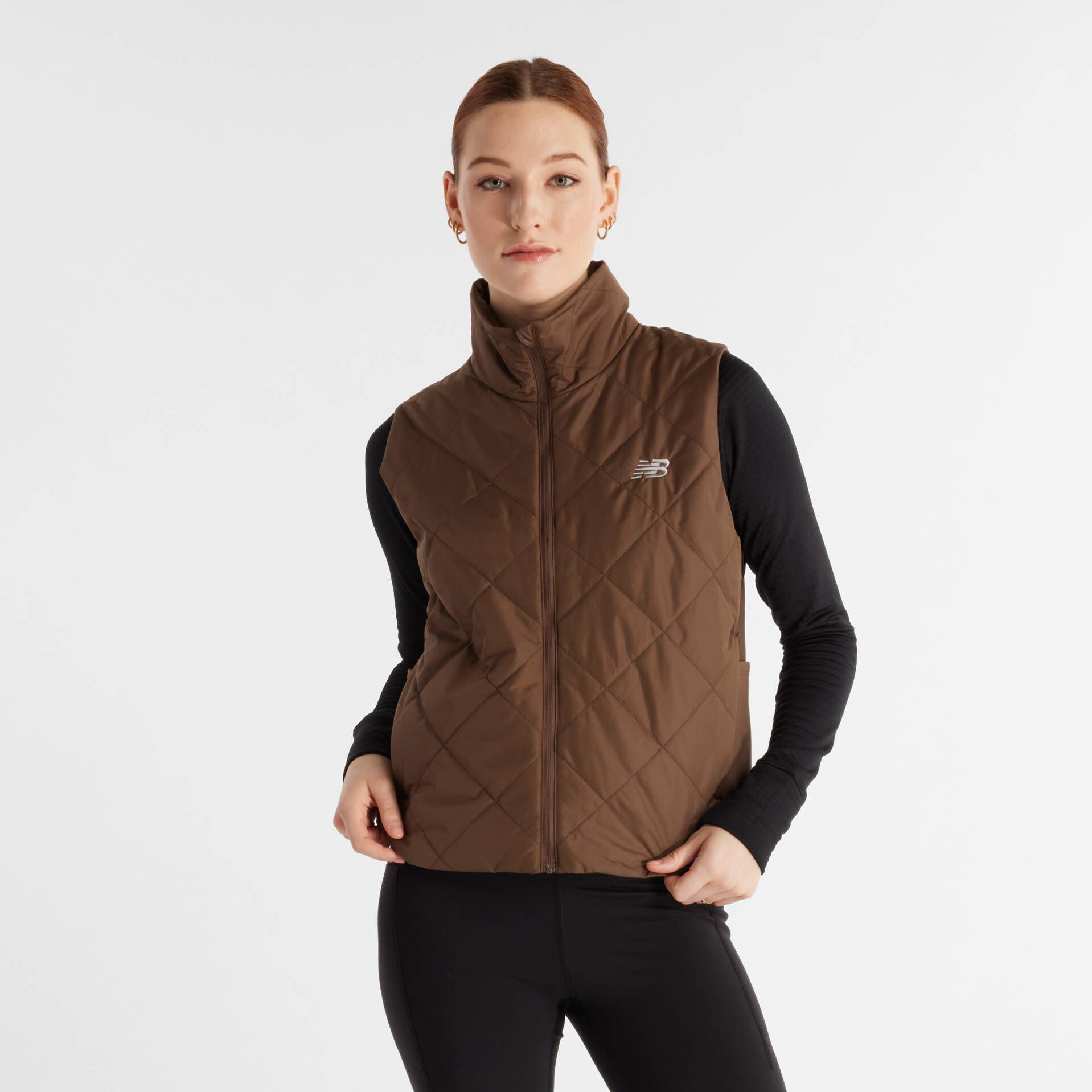 Woman in New Balance brown vest.
