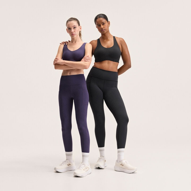 Women in New Balance sports bras and leggings.